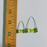 Ruler shows size difference between medium and large level wishbone earrings